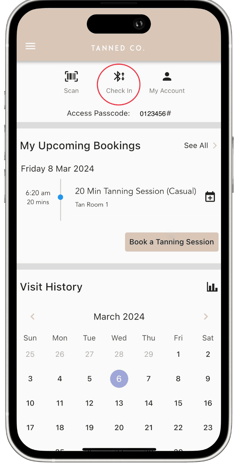 The Tanned Co. app home screen with the Book a Tanning Session button